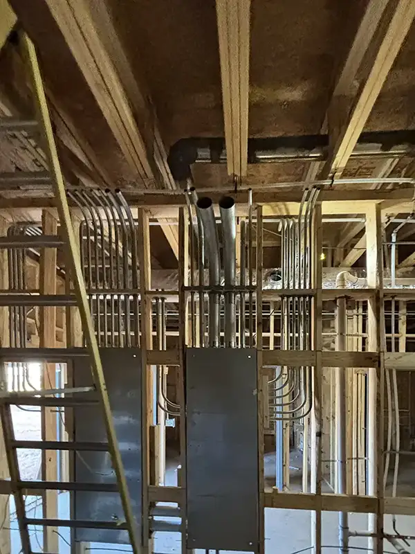 electrical panels and wiring on interior of building under construction