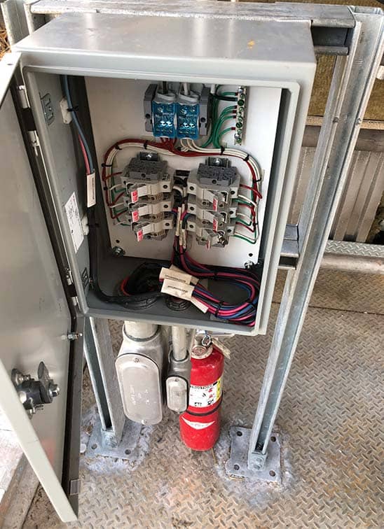 electrical box with fire extinguisher below