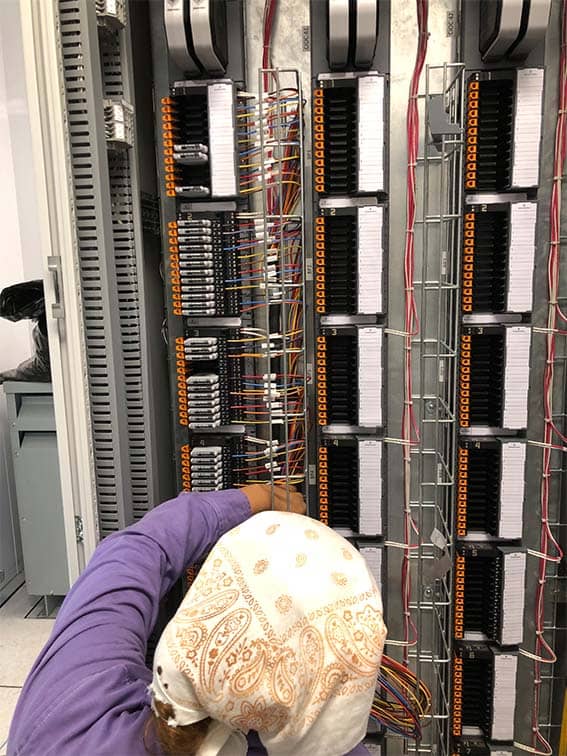 person working on an electrical panel