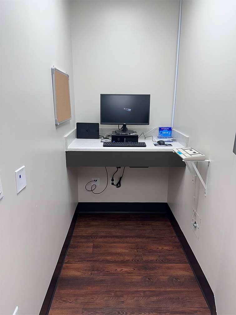 very small office with shelf with computer on it