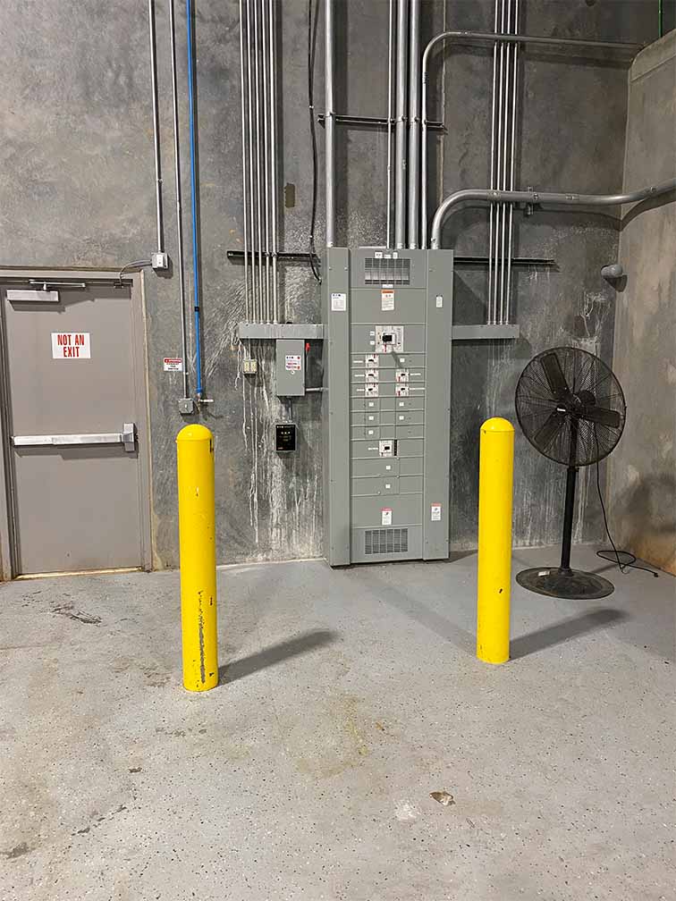 electrical wiring and panel in concrete room