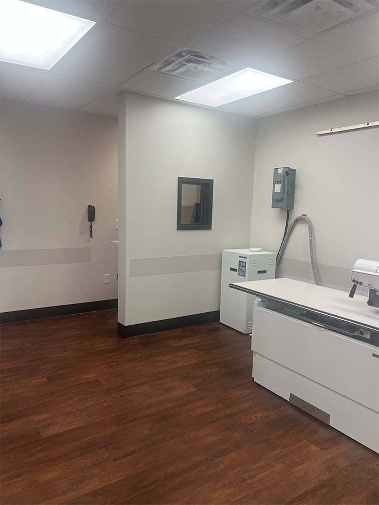 interior of medical office with bed